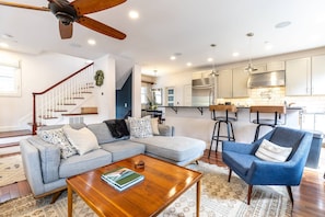 The open main floor space includes the kitchen, family and dining rooms as well as a powder room.