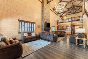 The vaulted ceilings and walls clad in knotty pine add to this cabin's rustic charm!