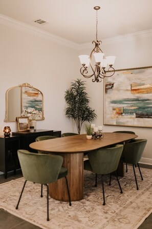 The dining room allows a more formal setting for up to 6 guests. 
