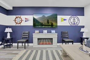 Step into a beautifully decorated space inspired by a yacht enthusiast, featuring nautical touches, crisp colors, and elegant coastal décor that creates a relaxing, seaside-inspired atmosphere.
