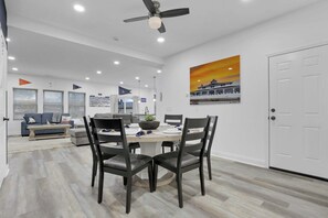 The dining area is open to both the living room and kitchen, creating a bright, welcoming space that's perfect for enjoying meals together and staying connected while you cook, dine, and relax.