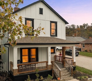 Welcoming Front Porch with rocking chairs