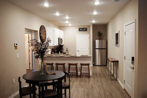 Dining room table for 4 and kitchen bar offers seating for 4 