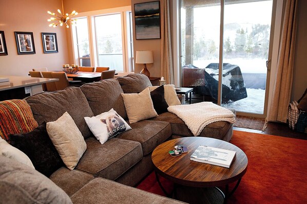 Cozy room with fireplace and TV for relaxing after your adventure-filled day.