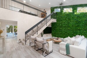 Bask in the grandeur of this open concept interior – boasting 2356 sq. feet of space and a lovely leafy wall that brings life into the space