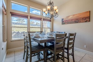 Enjoy meals in the bright and airy open dining area, where large windows invite an abundance of natural light to fill the space.