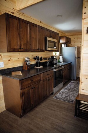 A full kitchen with brand new appliances