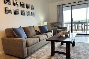 Living room with queen sleeper sofa & 2 armchairs.