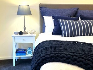Beautiful coastal styling in the 3rd bedroom with queen bed and wardrobes will please even the fussiest mother-in-law.