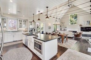 Open Kitchen / Dining / Living with Tall Vaulted Ceilings