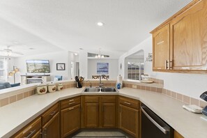 Nobody's left out! - Kitchen open to living & dining room