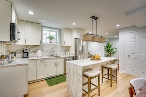 A stylish kitchenette finished with a high-end soft marble