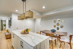 A stylish kitchenette finished with a high-end soft marble