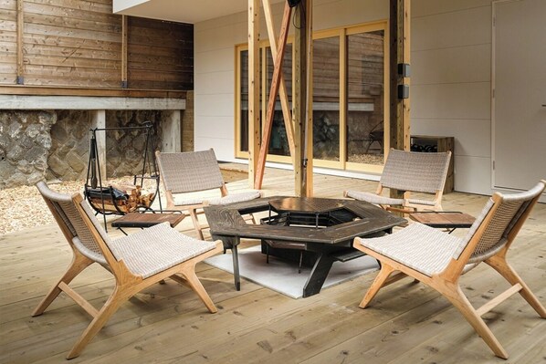 A suite-type dog base with an outdoor bonfire deck and indoor kitchen.