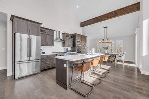 Kitchen: KitchenAid appliances, drip coffee maker, cooking utensils, tableware
