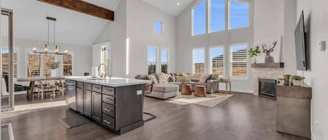 Living Room: 85” Smart TV, sound bar, gas fireplace, central heat and A/C