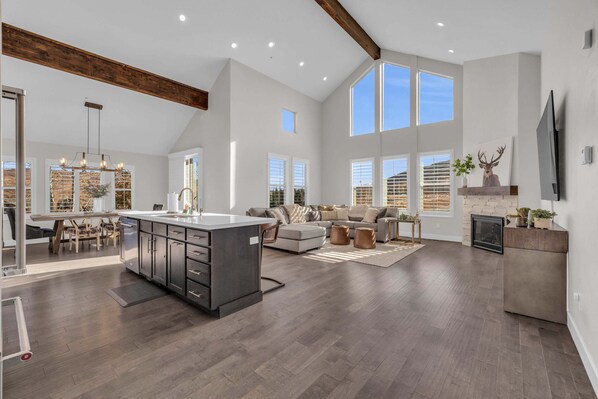 Living Room: 85” Smart TV, sound bar, gas fireplace, central heat and A/C