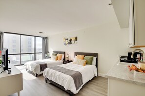 Studio | Sleeping Area | 2 Full Beds | Linens Provided | Smart TV