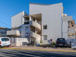 Sky, Vehicle, Car, Building, Urban Design, Asphalt, Condominium, Window