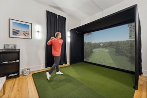 Full size Uneekor golf simulator room with GSPro - practice or play courses virtually from around the world. One of the only private golf simulators on the entire island. 