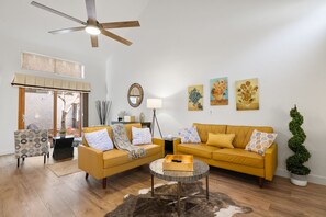 
A cozy yet modern living room in the pines, blending comfort and contemporary style amidst a serene natural setting.