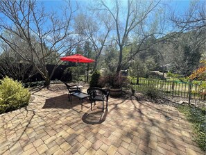 Enjoy the inviting patio amenities, ideal for relaxing, dining, or socializing outdoors.