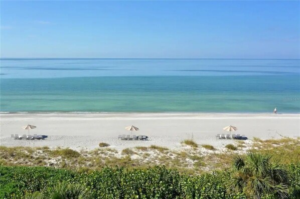 Private Beach on the Gulf of Mexico. Adjustable loungers, chairs + umbrellas.