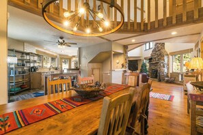 This dining space has seating for eight with an additional table for four. Everything flows beautifully from one room to the other in this uniquely artful floorplan