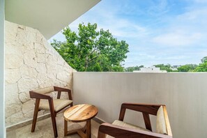 Step out onto the balcony and enjoy stunning views with a refreshing breeze