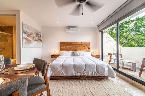 Cozy up in this comfortable bed and enjoy meals at the charming dining table
