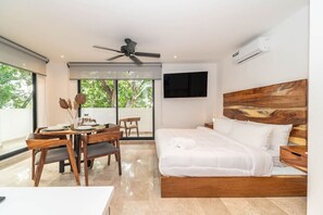 Cozy up in this comfortable bed and enjoy meals at the charming dining table