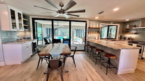 The dining area has seating for 10 and access to the pool.