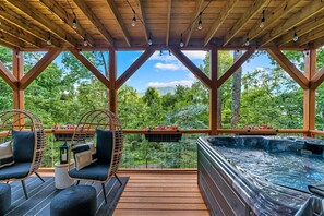 Lower deck features a hot tube overlooking views of the Blue Ridge Mountains.