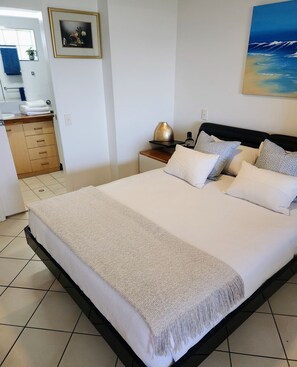 Bedroom super luxury mattress with new linen and pillow Showing en-suit bathroom