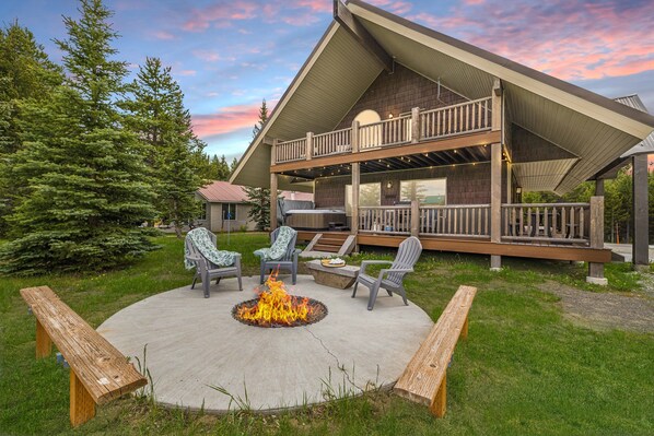 vhot tub, fire pit, and ample places to gather for the group!