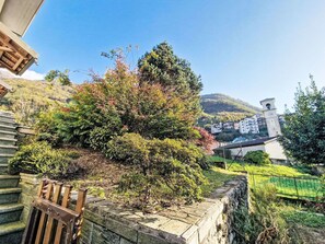 Sky, Plant, Building, Natural Landscape, Wood, Tree, Slope, Residential Area, Grass, Cottage
