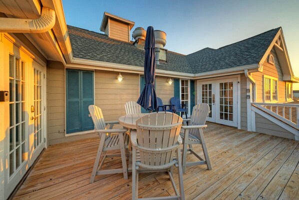 Outdoor space with a dining area and seating.