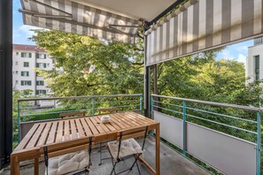 Relax and unwind on this spacious balcony.