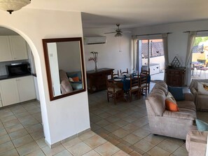 Large living and dining room leading out to patio