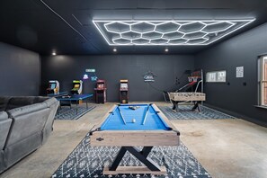 Enjoy endless fun in the ultimate game room, complete with a pool table, arcade games, foosball, and basketball hoops. Perfect for family bonding or friendly competition during your stay near Glacier National Park in Kalispell, MT
