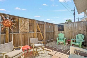 Relax and unwind in our backyard with comfortable outdoor seating, perfect for enjoying the fresh air.