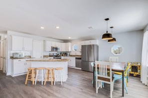 This is a picture of the kitchen in the Sel de Vie vacation rental. The kitchen is large and fully stocked with everything you need to cook and serve meals. Upper Level