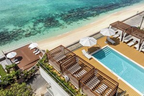 In addition to the rooftop pool, guests can also access the beach deck overlooking the ocean. 