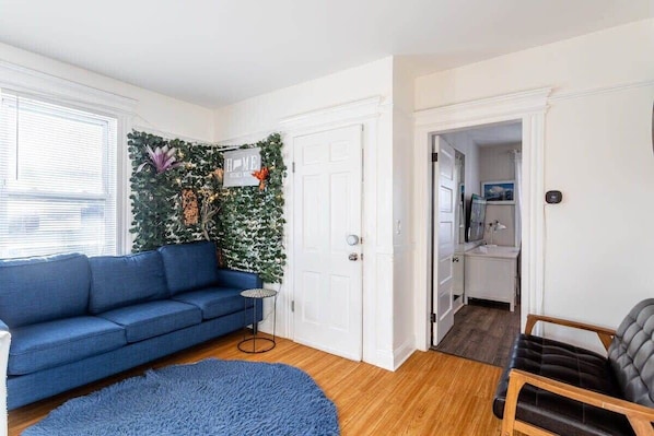 Cozy and spacious living room with natural light.