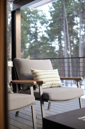 Patio with outdoor seating and gas fireplace, main level.
