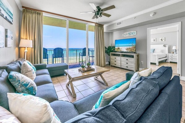 Open concept living area with comfortable furnishings TV