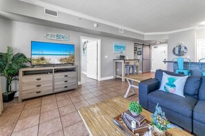 Open concept living area with comfortable furnishings TV
