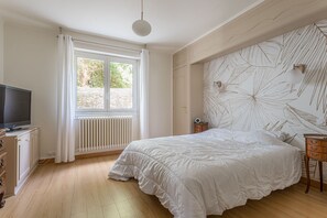 Ground floor bedroom with television