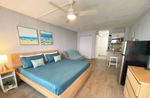 Experience a cheerful escape in this beautifully decorated bedroom.