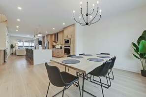 Open to the kitchen and living area, perfect for family meals and gatherings.
